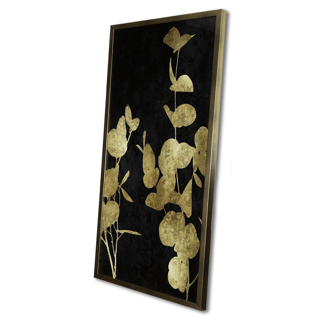 Decorative wall art with gold leaf design on a black background