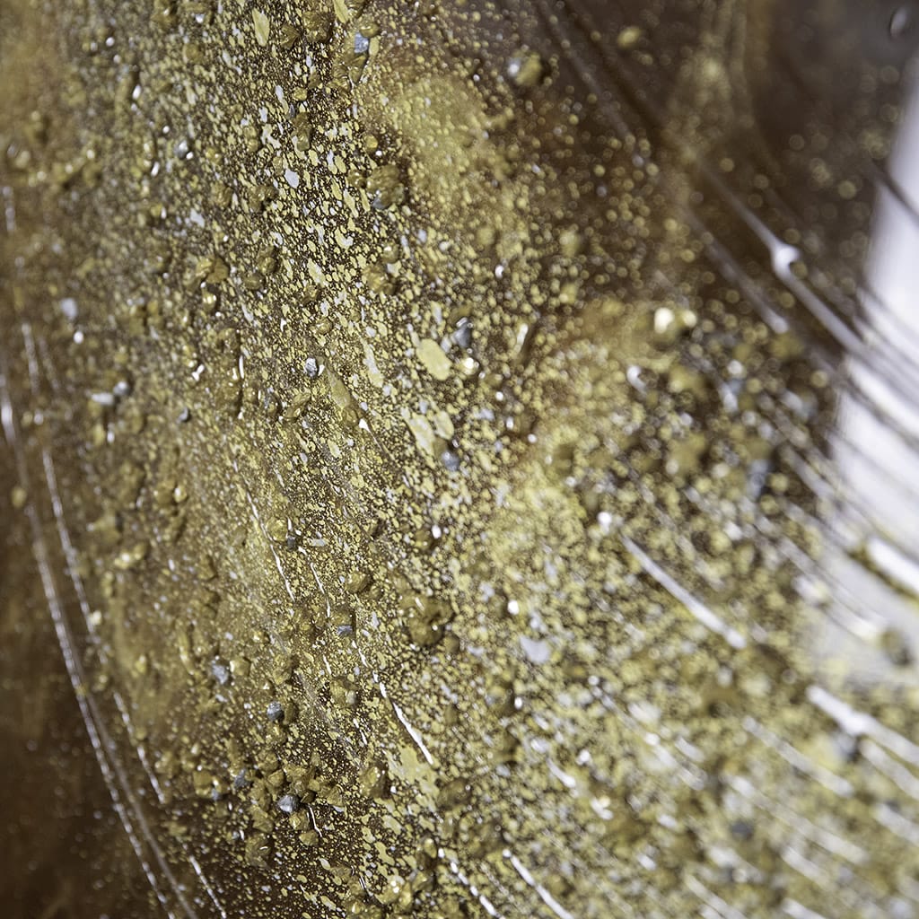 close up detail of texture on an abstract resin wall art in gold, browns silver. Glossy luxury finish, Hand made by elysian bespoke