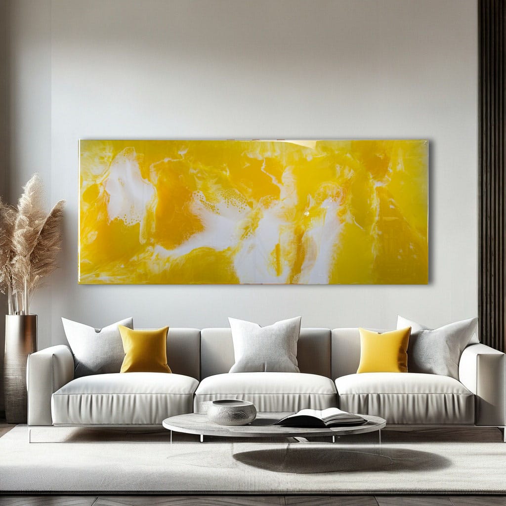 Large yellow and white abstract resin metal wall art, glossy finish over a modern sofa.