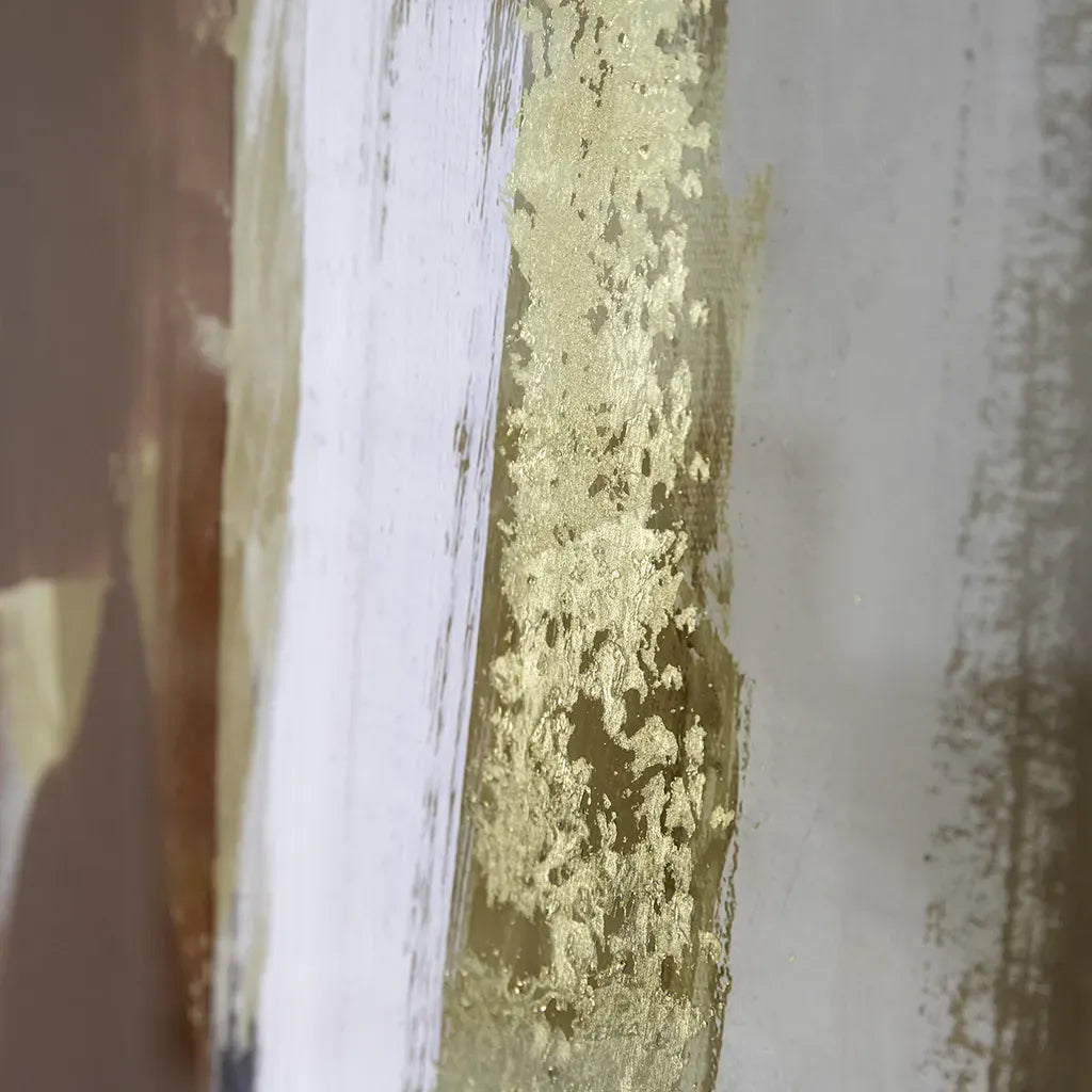 Close-up of a textured surface with gold and white patterns