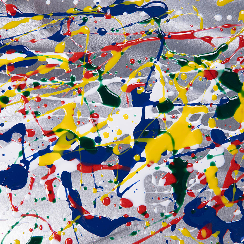 Abstract art with splashes of red, yellow, blue, and green on a metal background