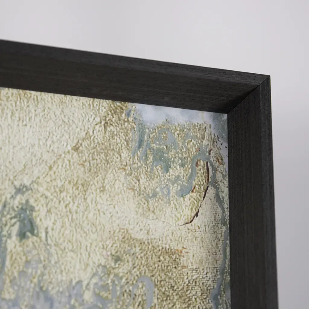 close up detail of the frame on a piece of modern luxury framed wall art, in green, teals and gold detailing. framed in a grey grained frame. handmade by elysian bespoke