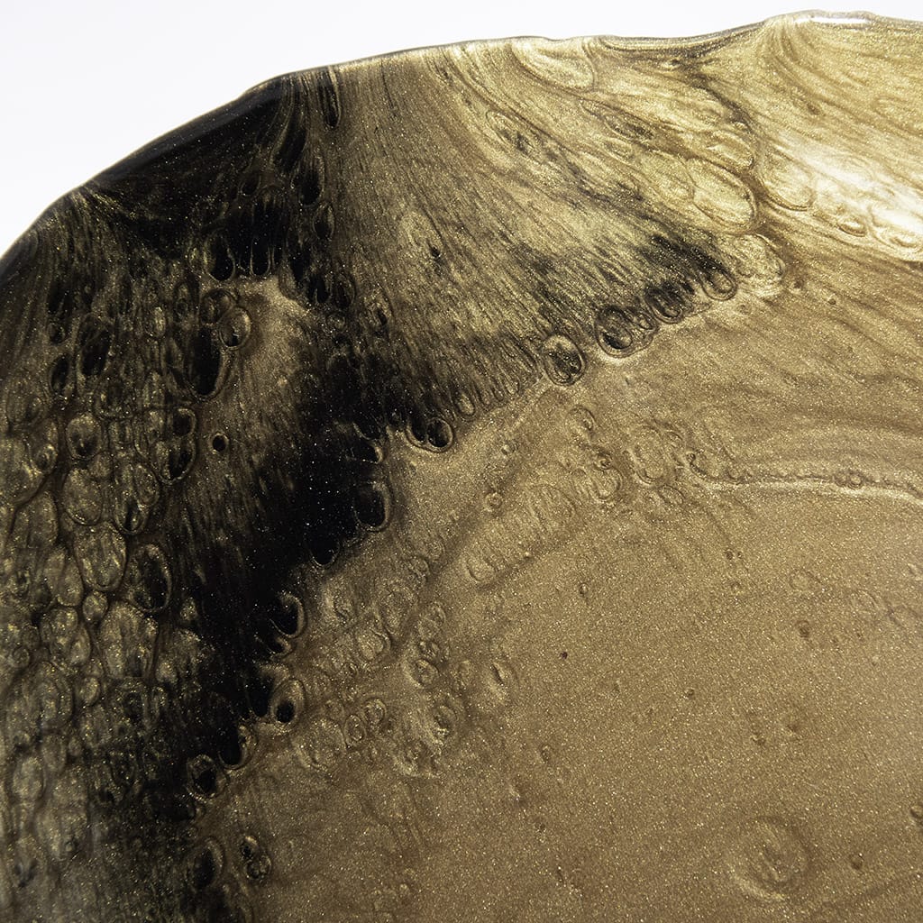Close up detail of Handmade luxury gold resin wall art by Elysian bespoke featuring metallic gold, bronze and black abstract textures on a long rounded panel.Contemporary statement artwork for modern living rooms and luxury interior design.