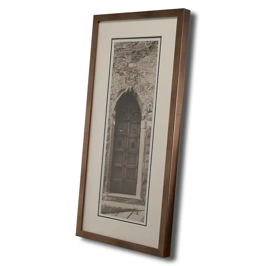 side view of Bronze framed Italian stone archway wall art featuring a historic rustic wooden doorway in monochrome architectural photography. Handmade luxury framed artwork by Elysian Bespoke for contemporary home