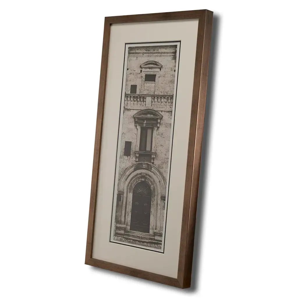 Bronze framed Italian stone archway wall art featuring a historic rustic wooden doorway in monochrome architectural photography. Handmade luxury framed artwork by Elysian Bespoke for contemporary home