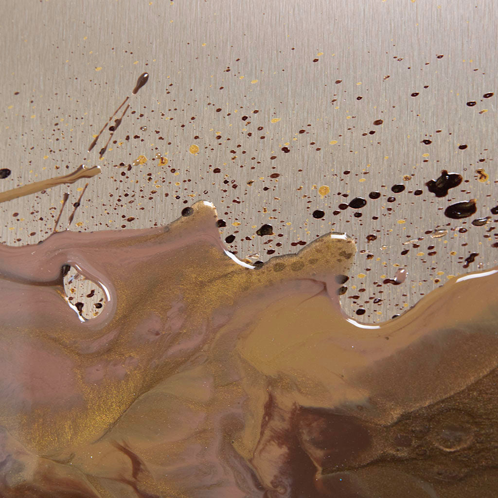 Abstract resin wall art with brown and black splashes on a textured soft gold background