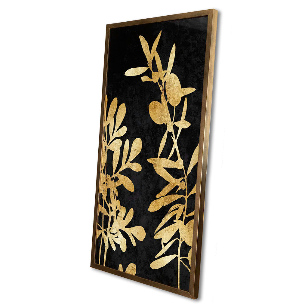 Decorative wall art with gold leaf design on a black background