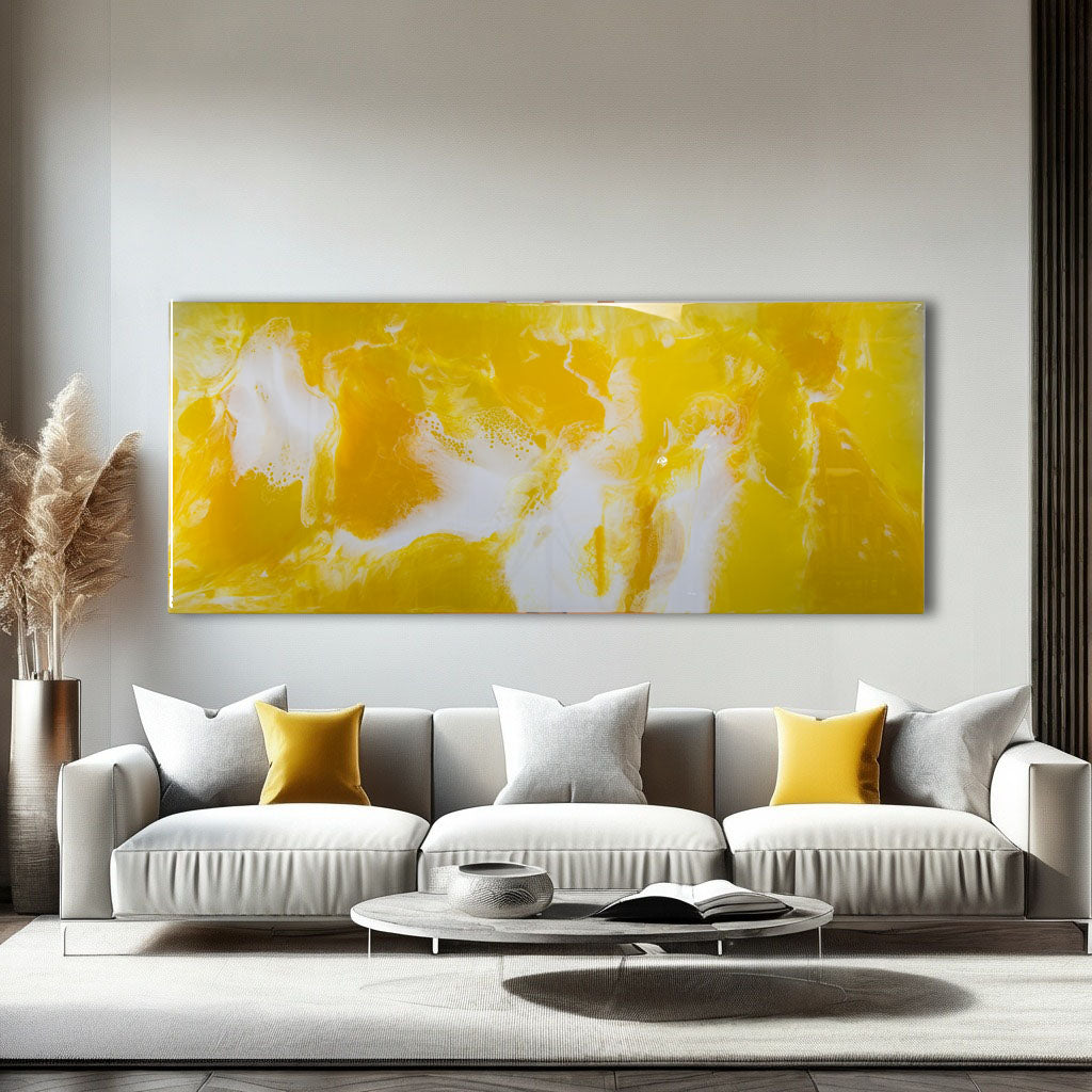 Large yellow and white abstract resin metal wall art, glossy finish over a modern sofa.