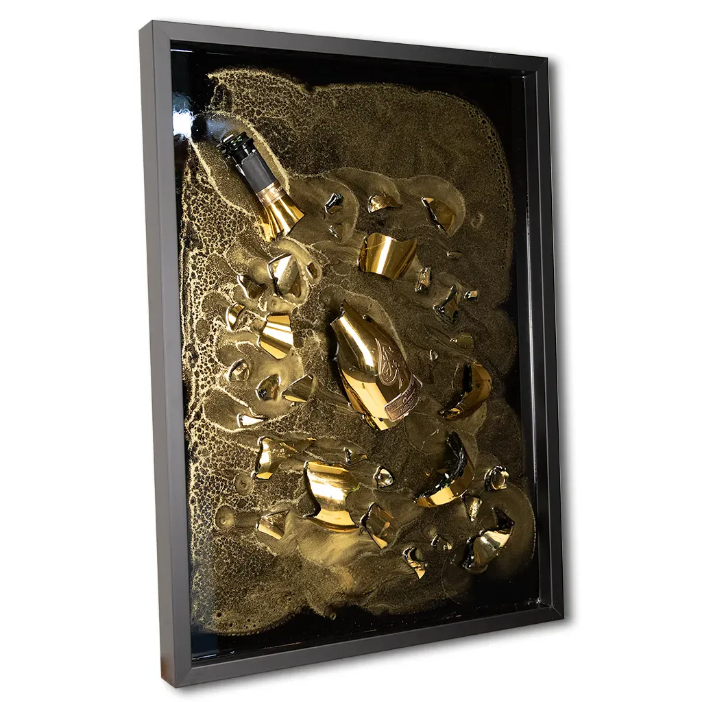 right angled One-of-a-kind Armand de Brignac gold bottle and fragments set in textured metallic resin, handmade and framed by British artist Paul Marshall
