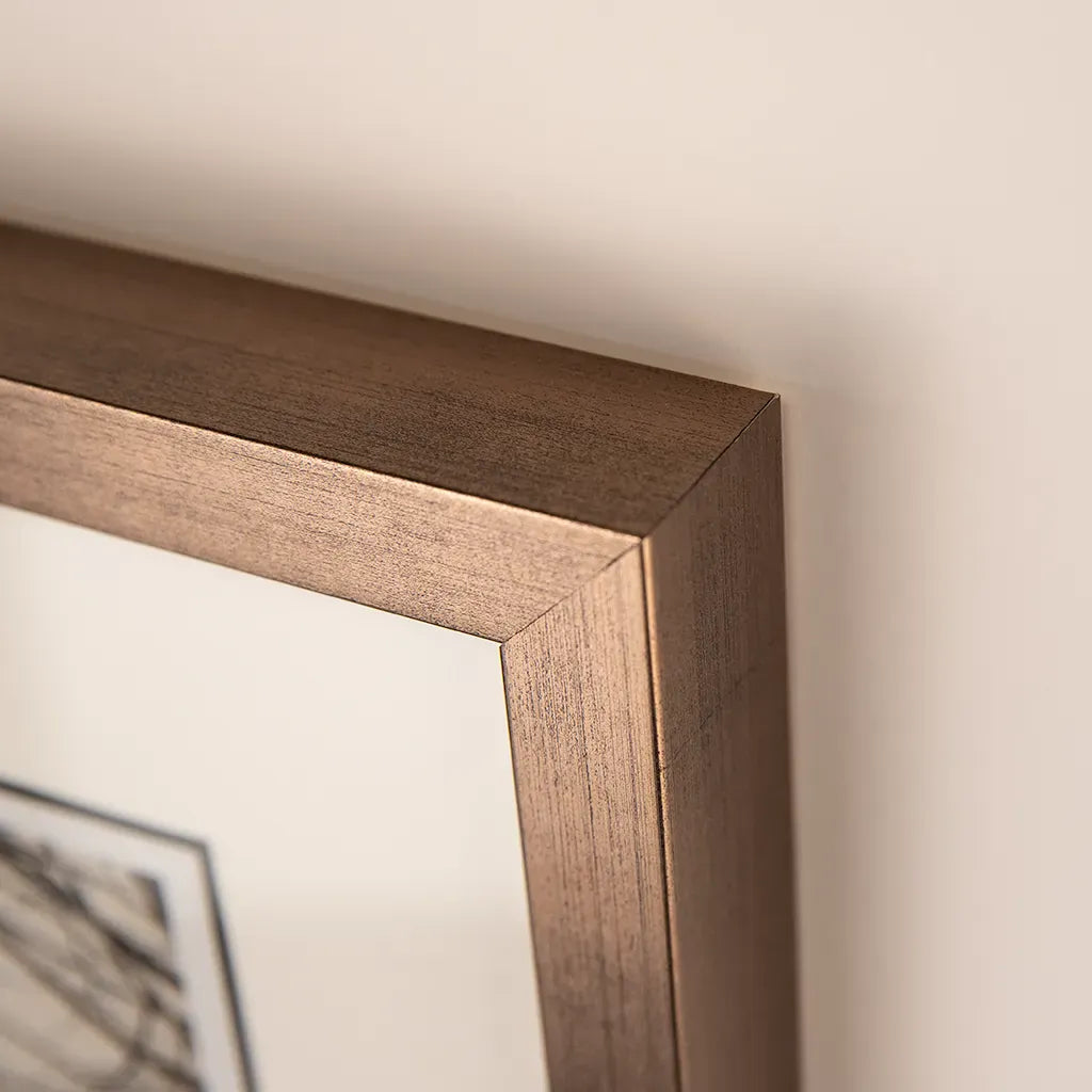 detail of outer framing on Bronze framed Italian stone archway wall art featuring a historic rustic wooden doorway in monochrome architectural photography. Handmade luxury framed artwork by Elysian Bespoke for contemporary home interiors.