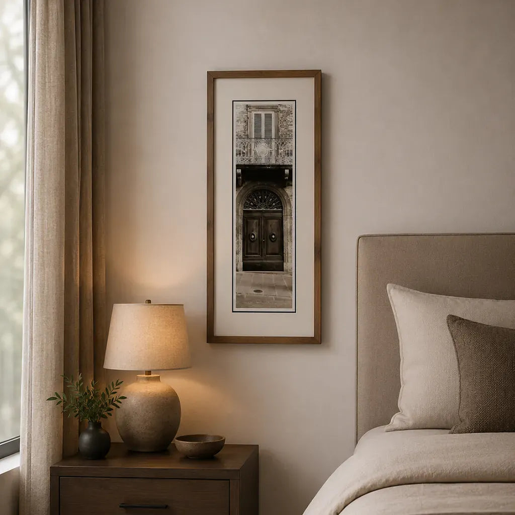 lounge with Bronze framed Italian stone archway wall art featuring a historic rustic wooden doorway in monochrome architectural photography. Handmade luxury framed artwork by Elysian Bespoke for contemporary home interiors.