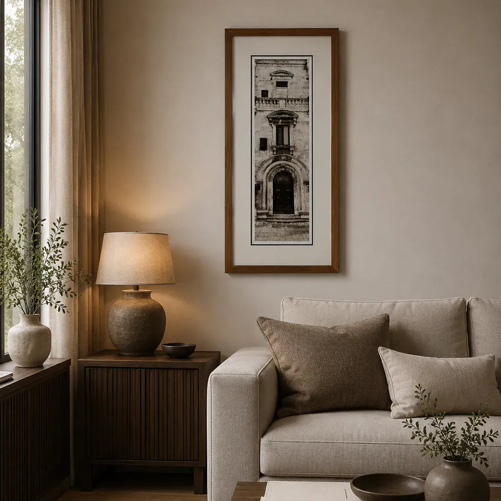 frame detail on a Bronze framed Italian stone archway wall art featuring a historic rustic wooden doorway in monochrome architectural photography. Handmade luxury framed artwork by Elysian Bespoke for contemporary home 
