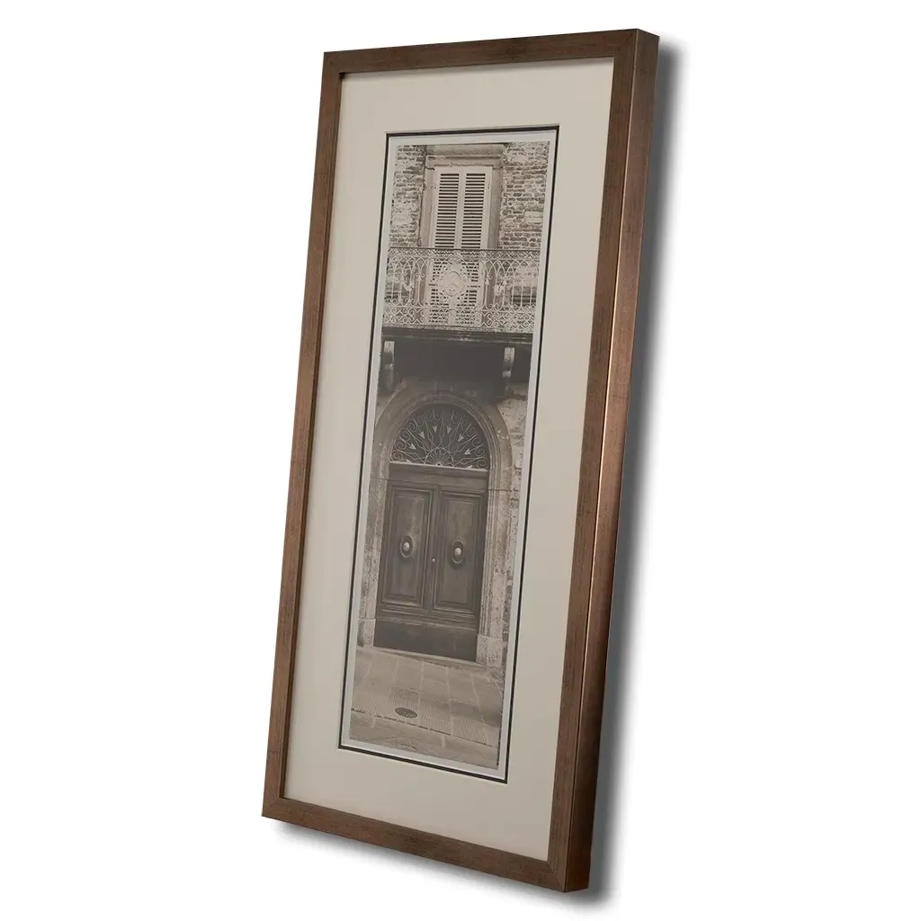 Side view of Bronze framed Italian stone archway wall art featuring a historic rustic wooden doorway in monochrome architectural photography. Handmade luxury framed artwork by Elysian Bespoke for contemporary home interiors.
