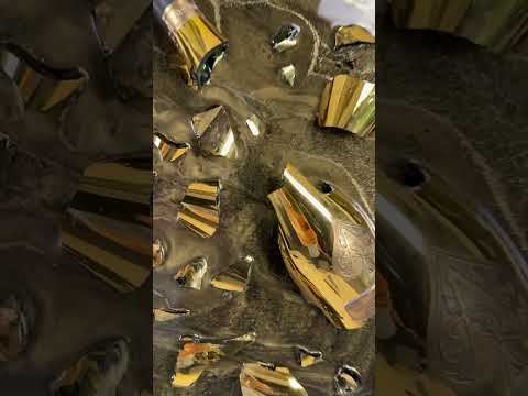 video of One-of-a-kind Armand de Brignac gold bottle and fragments set in textured metallic resin, handmade and framed by British artist Paul Marshall
